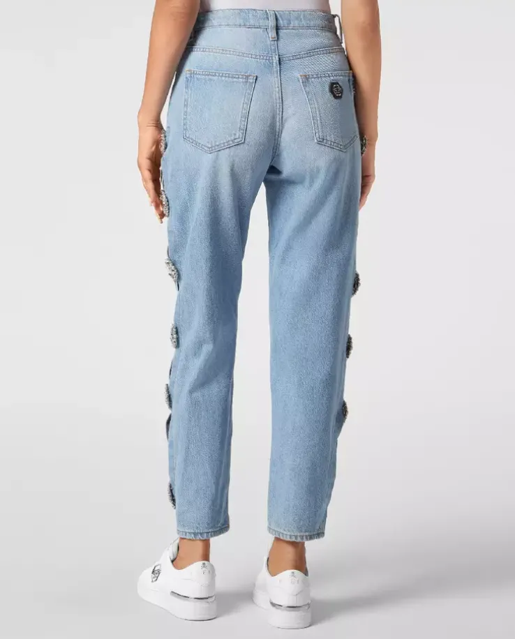 Jasnoniebieskie jeansy z wycięciami